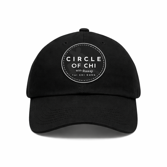 Black cap with 'Circle of Chi' logo on a white background