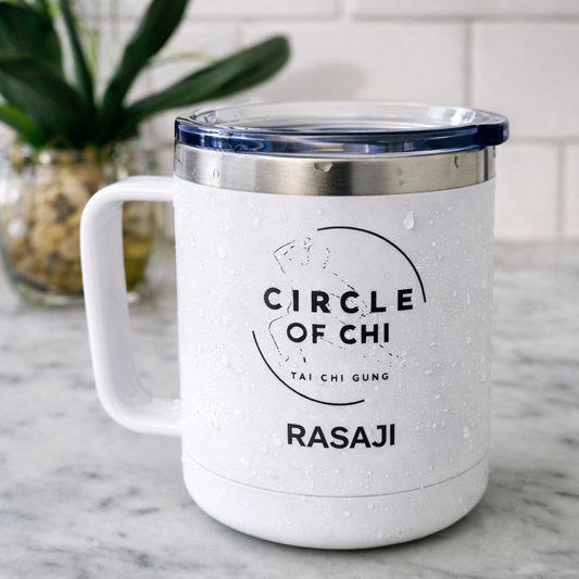 White mug with 'Circle of Chi' branding on a marble surface
